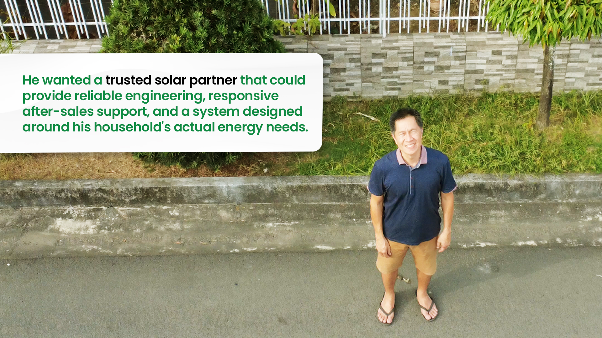 Armand Sia standing on the street outside his home after partnering with GoSolar Philippines