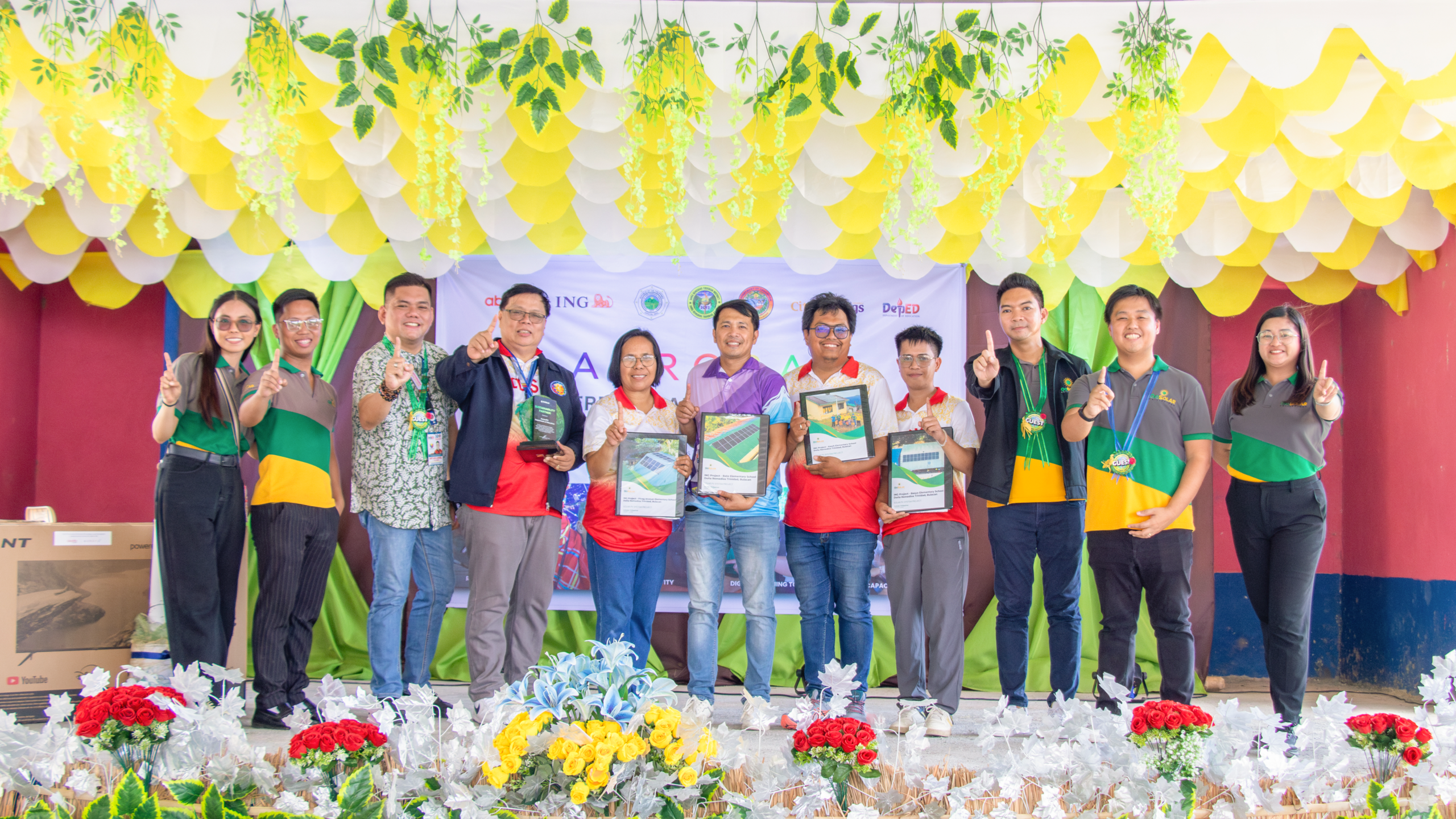 GoSolar Philippines, AuroraPH and school representatives holding certificates at the project turnover